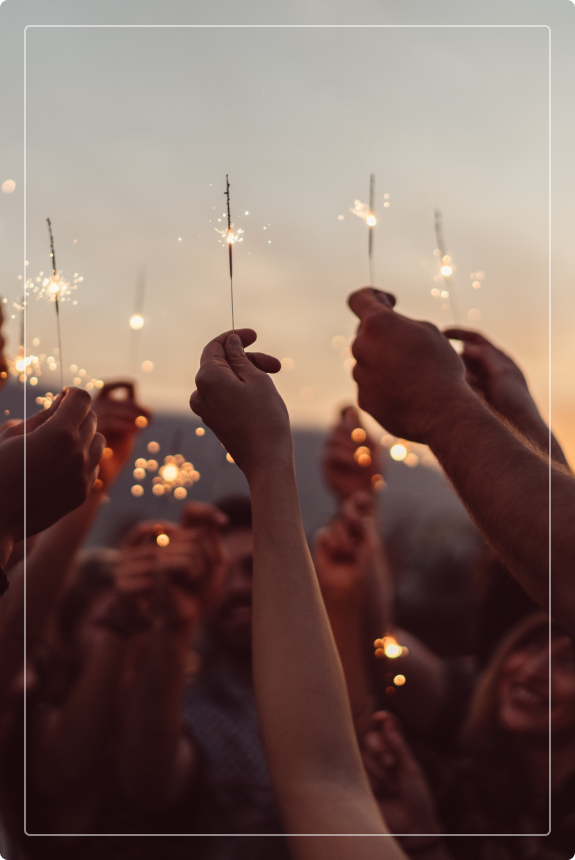 people holding sparklers