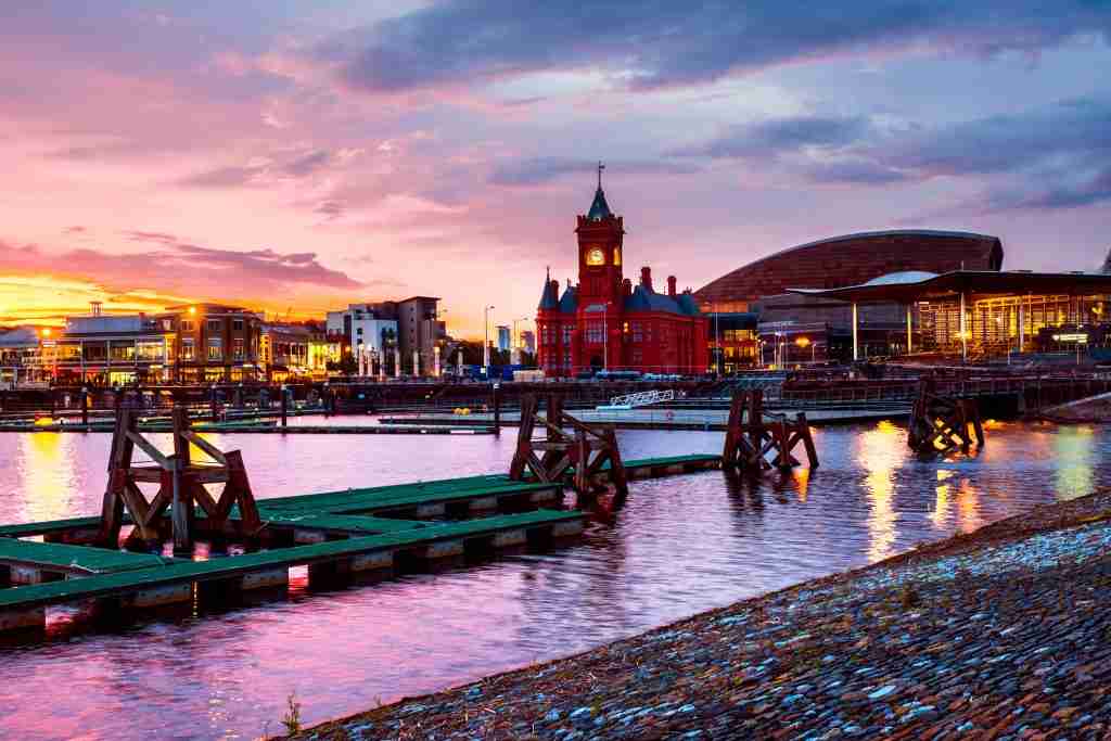 direct cremation in Cardiff - image of Cardiff Waterfront at night with a sunset sky for location