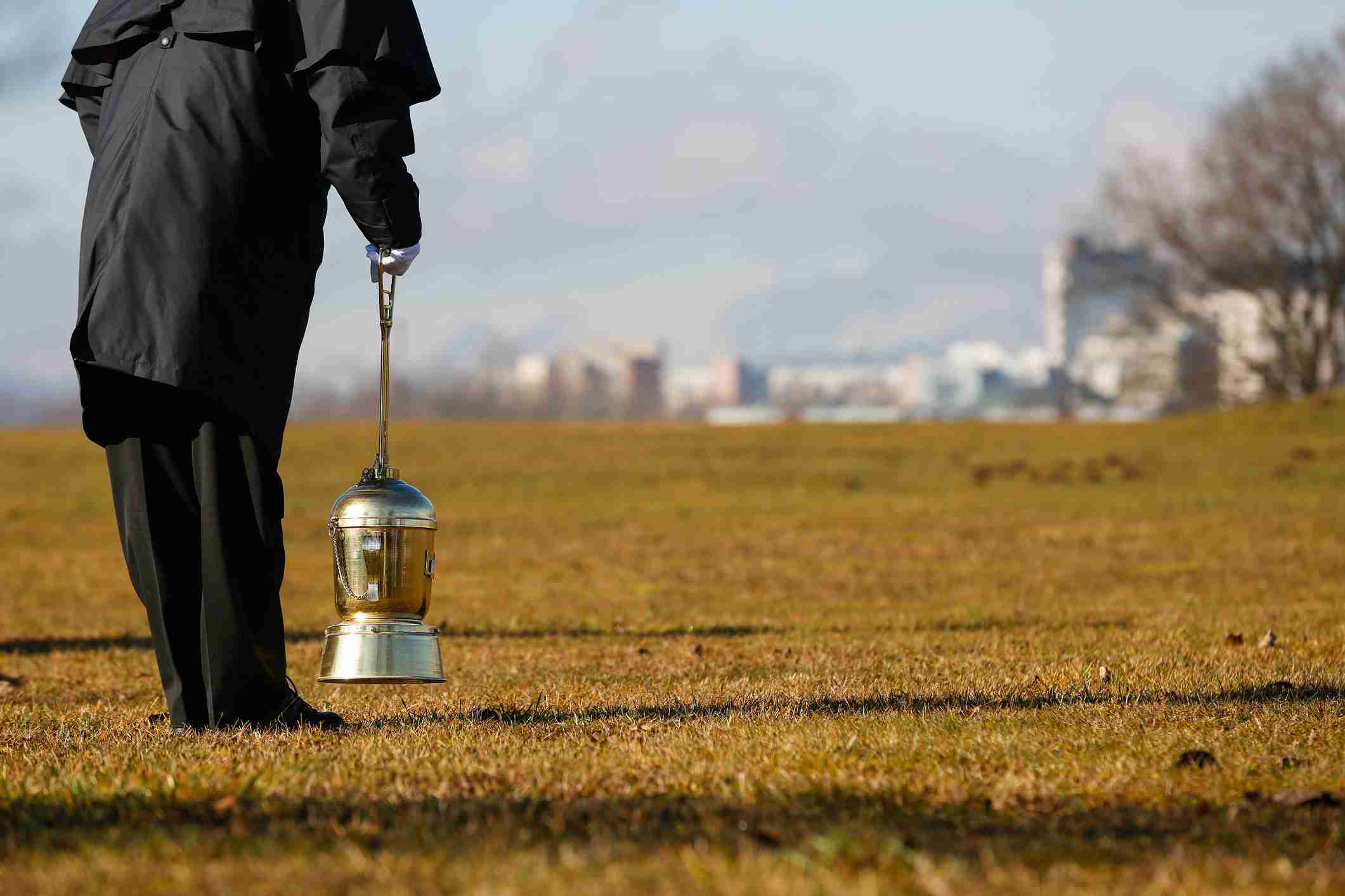 arrange a direct cremation - undertaker scattering ashes in a field