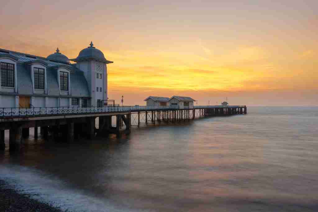 direct cremation in vale of glamorgan - Penarth Pier With Pebble Beach And The Bristol Channel, Wales, United Kingdom At Sunrise.